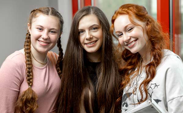 Three girls smiling