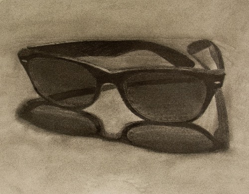 charcoal of sunglasses on table