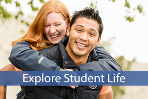 Explore Student Life with two smiling students outside campus